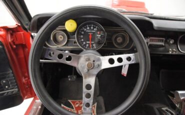 Unknown-Mustang-1965-Rangoon-Red-Black-28