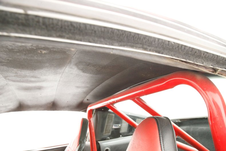 Unknown-Mustang-1965-Rangoon-Red-Black-39