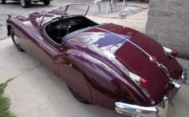 Unknown-Xk140-1955-MaroonBlack-Top-Black-Leather-11