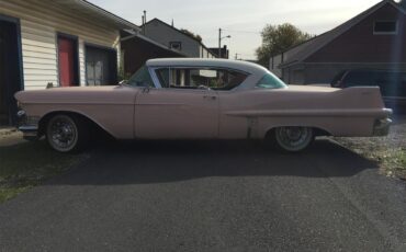 Cadillac-Coupe-deville-1957-Laurel-Mountain-Pink-PinkSilver-6