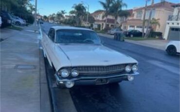 Cadillac-Deville-1961-White-Black