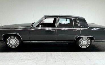 Cadillac-Fleetwood-1985-Dark-Gray-Firemist-M-Dark-Red