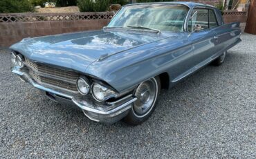 Cadillac-coupe-deville-1962-blue-9