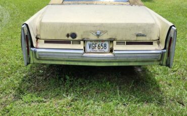 Cadillac-deville-1976-yellow