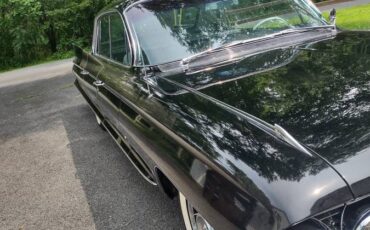 Cadillac-fleetwood-1961-black-12