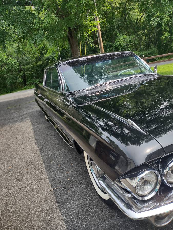 Cadillac-fleetwood-1961-black-12
