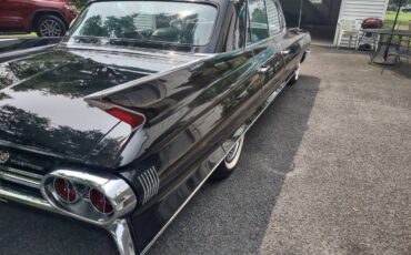 Cadillac-fleetwood-1961-black-13