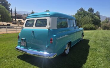 Chevrolet-Suburban-1955-Turquoise-White-4