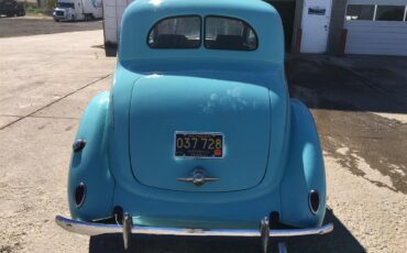 Ford-5-window-coupe-1938-Blue-Tan