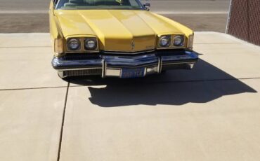 Olds-toronado-1973-yellow-1