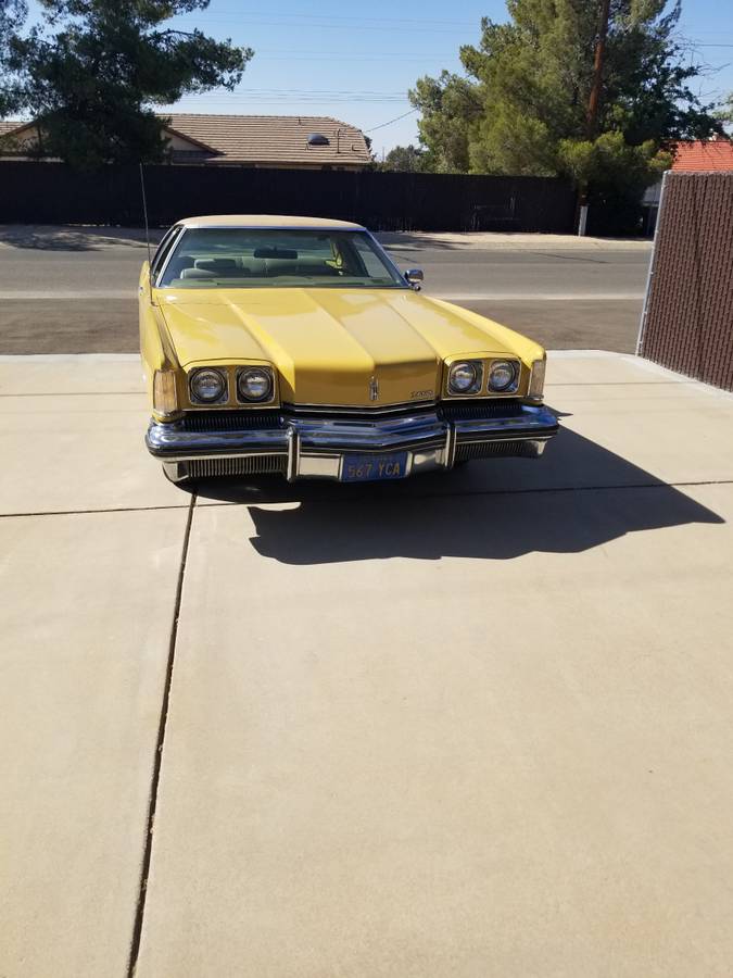 Olds-toronado-1973-yellow-1