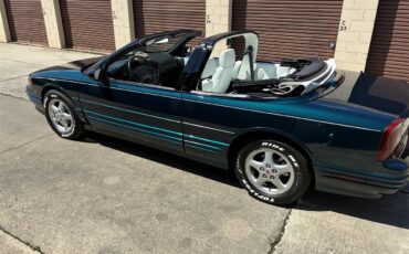 Oldsmobile-Cutlass-supreme-1995-Metallic-teal-White-1