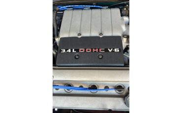 Oldsmobile-Cutlass-supreme-1995-Metallic-teal-White-13