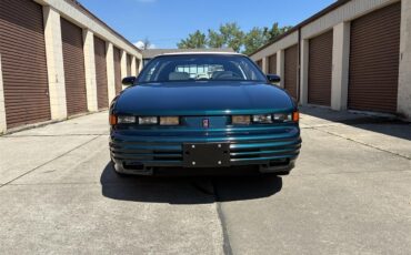 Oldsmobile-Cutlass-supreme-1995-Metallic-teal-White-2