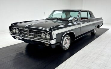 Oldsmobile-Starfire-1963-Ebony-Black-Red