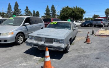 Oldsmobile-cutlass-supreme-brougham-1986-grey-1