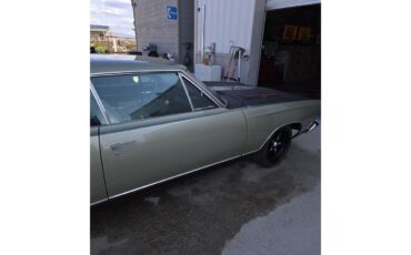 Plymouth-Gtx-1969-Sage-green-gold-Black-white-blue-6