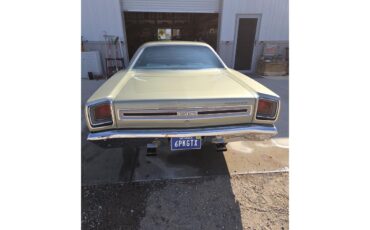 Plymouth-Gtx-1969-Sage-green-gold-Black-white-blue-9
