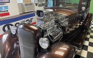 Plymouth-Pd-deluxe-1933-Root-Beer-Metallic-Tan-9