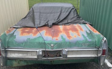 Cadillac-coupe-deville-1967-green-2