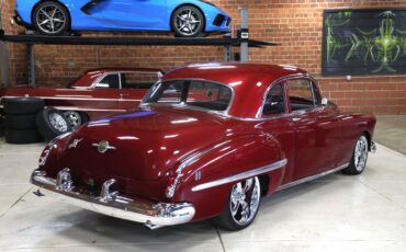 Oldsmobile-Rocket-88-1949-Burgundy-Dark-Charcoal-49