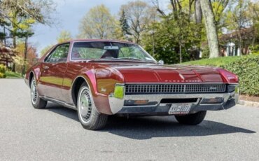 Oldsmobile-Toronado-1967-Red-Red-14