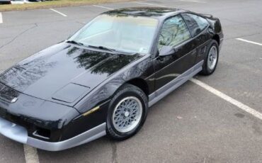Pontiac-Fiero-1986-Black-Tan