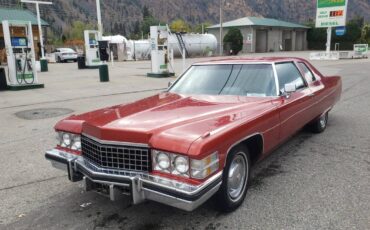 Cadillac-coupe-deville-1974-orange