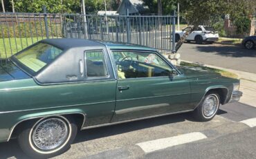 Cadillac-coupe-deville-1978-green-13