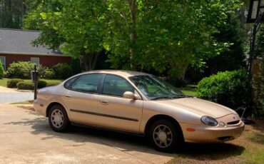 Ford-taurus-gl-1996-yellow-1