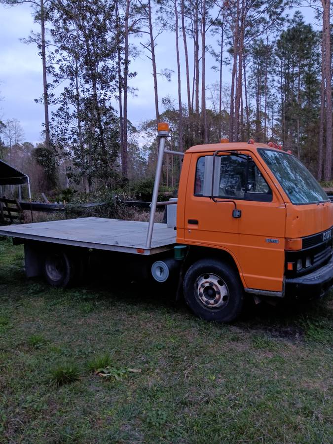 Isuzu-npr-flatbed-diesel-1995-orange