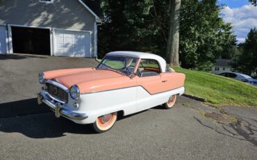 Metropolitan-562-1957-Coral-And-White-Gray