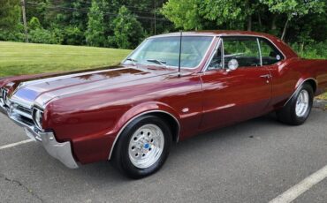Oldsmobile-Cutlass-1966-Red-Black