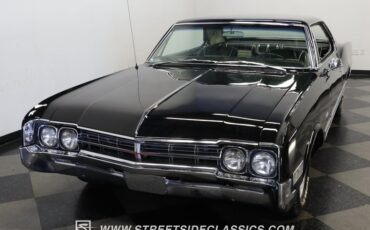 Oldsmobile-Starfire-1966-Black-Black-and-White-14