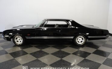 Oldsmobile-Starfire-1966-Black-Black-and-White-47