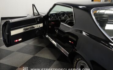 Oldsmobile-Starfire-1966-Black-Black-and-White-49