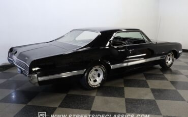 Oldsmobile-Starfire-1966-Black-Black-and-White-9