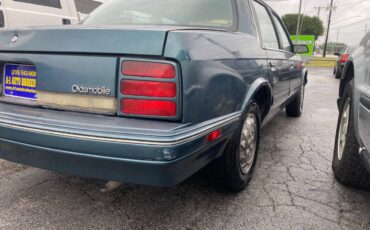 Oldsmobile-cutlass-ciera-1996-green-56