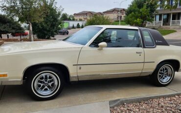 Oldsmobile-cutlass-supreme-brougham-1985-yellow-6