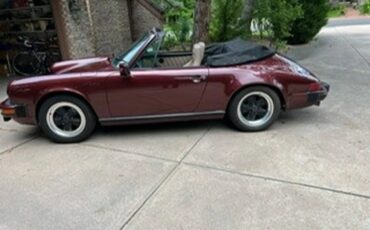 Porsche-911-1983-Ruby-Red-Metallic-Tan