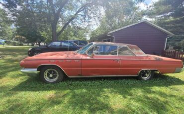 Buick-Electra-225-1962-red-gray-1