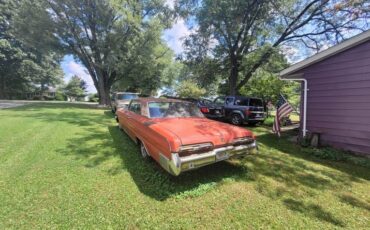 Buick-Electra-225-1962-red-gray-2