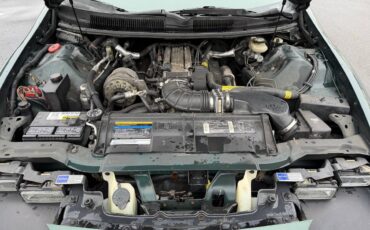 Chevrolet-camaro-z28-1994-green-20