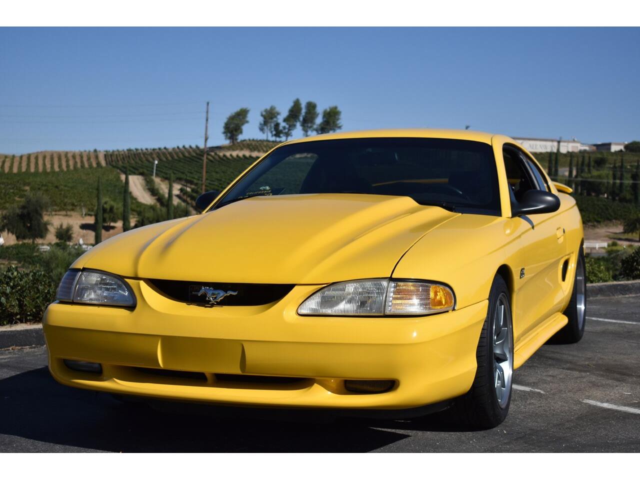 Ford-Mustang-gt-1994-Canary-Yellow-Black-1