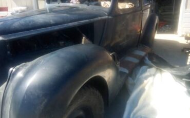 Packard-v-12-touring-sedan-1938-blue-1