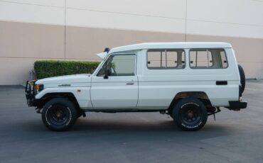 Toyota-land-cruiser-troop-carrier-troopy-hzj75-die-1994-white-1