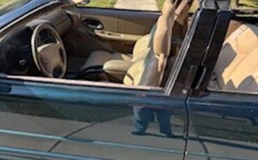 Oldsmobile-Cutlass-supreme-1995-Blue-Green-Metallic-Tan-16