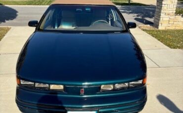 Oldsmobile-Cutlass-supreme-1995-Blue-Green-Metallic-Tan