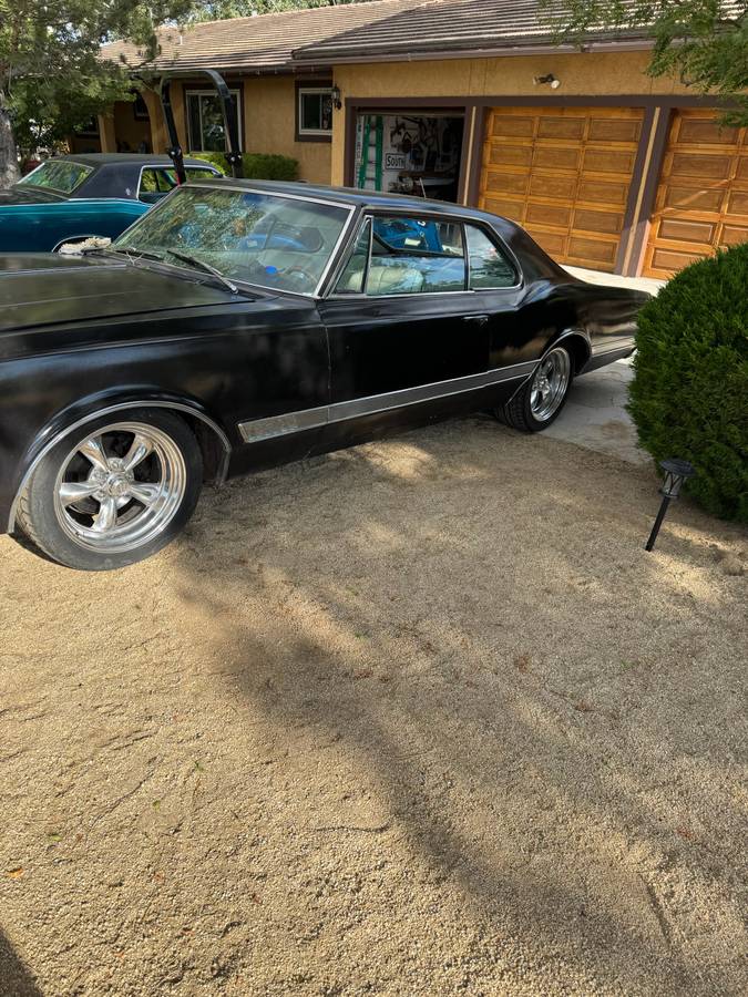 Oldsmobile-Starfire-1966-black
