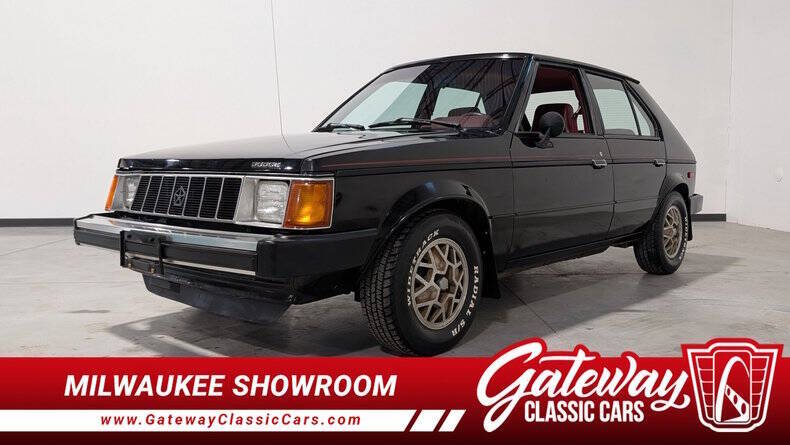 Dodge-Omni-1987-Black-Burgandy